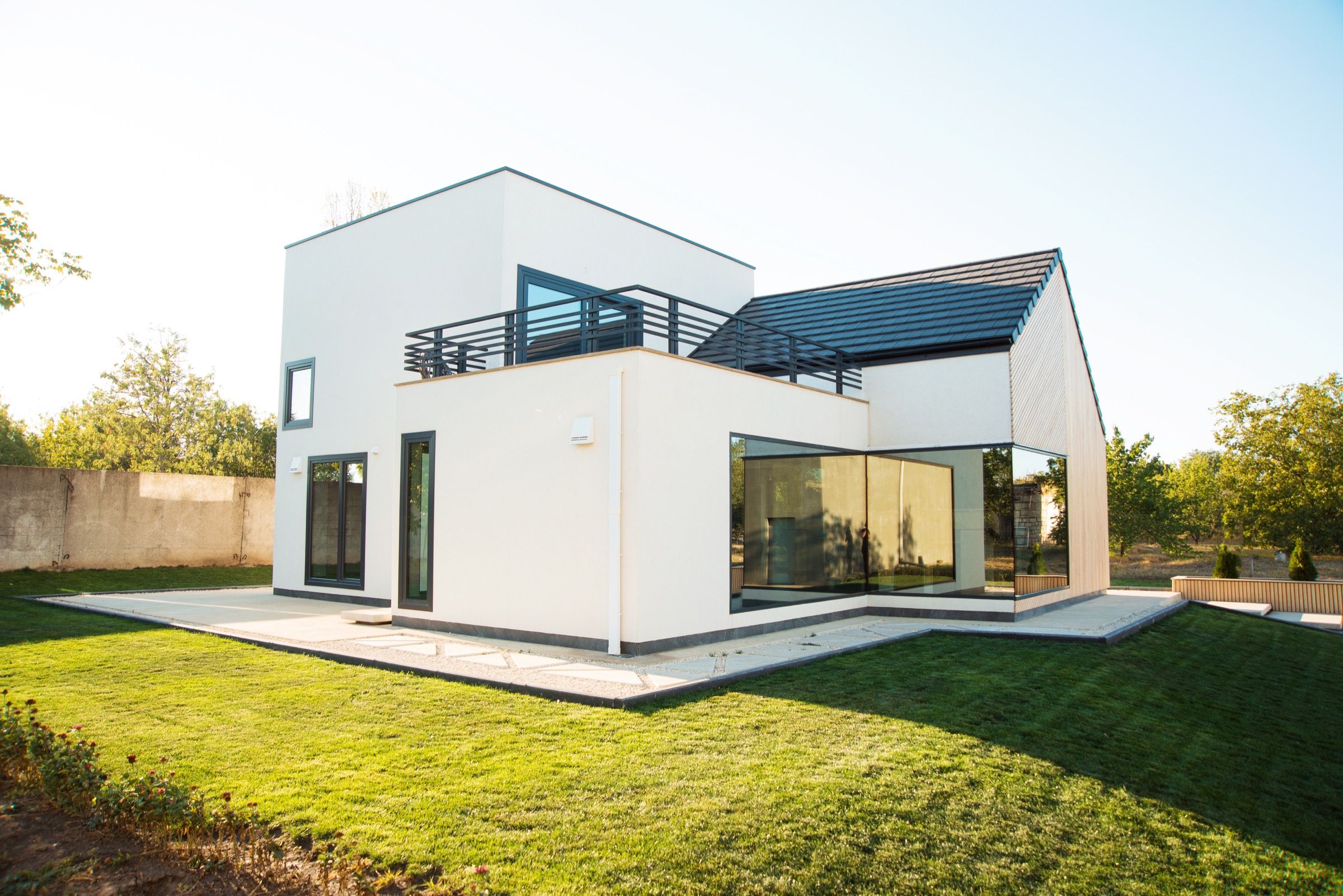 A completed Uniqa home with a pitched roof, built from prefabricated timber-frame panels