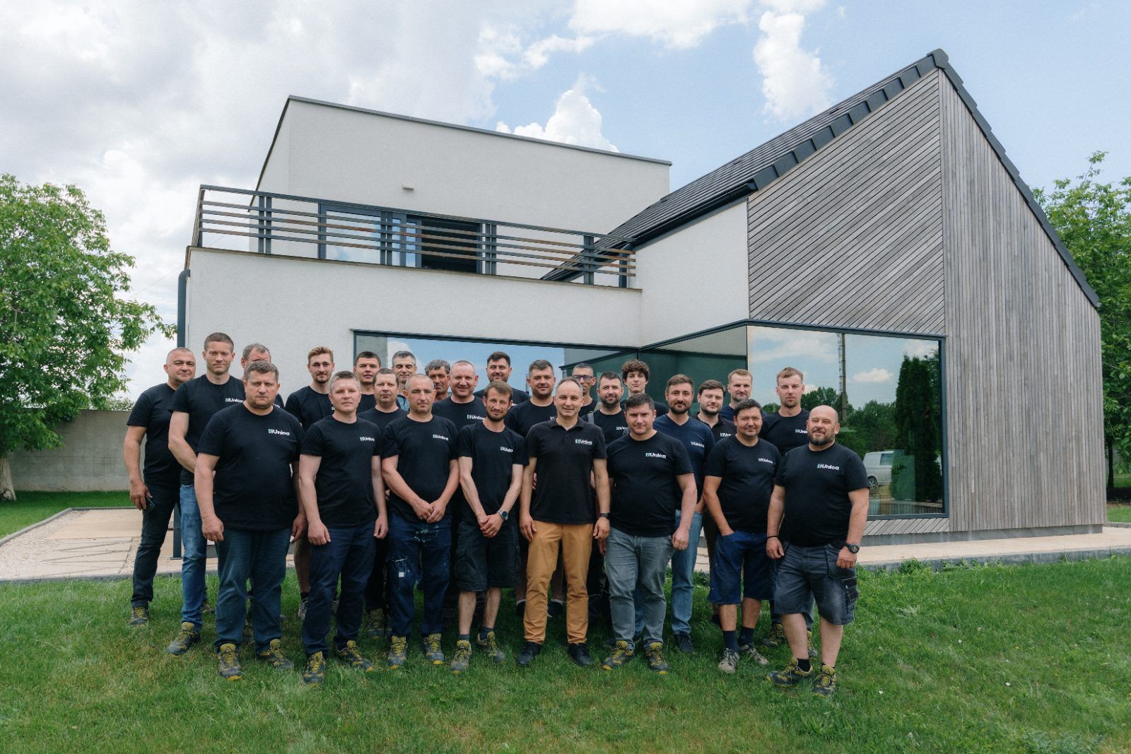 The Uniqa team in front of the company show house in Ștefan Vodă, Moldova