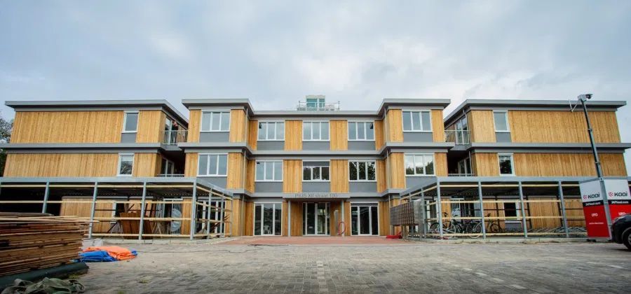 Timber-clad apartment building assembled from prefabricated wall systems, Wijchen